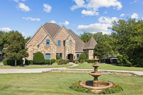 a swimming pool with outdoor seating and yard