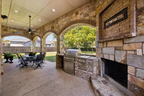 a view of a swimming pool with outdoor seating