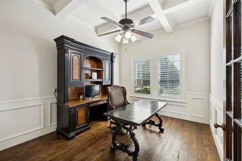 a workspace with furniture window and wooden floor