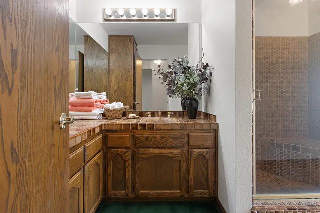 a bathroom with a sink and a mirror