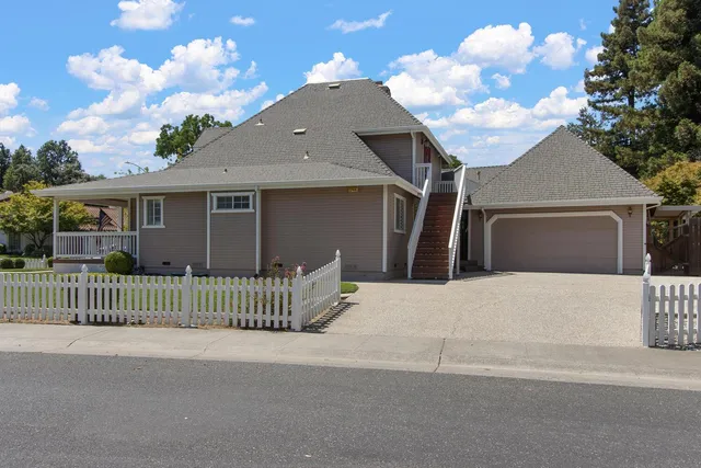 a front view of a house with a garage