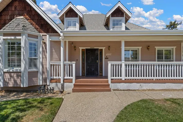 front view of a house with a yard