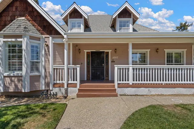 front view of a house with a yard