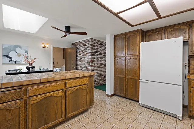 a kitchen with stainless steel appliances a refrigerator and a sink