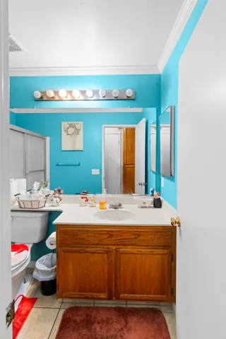 a view of hallway with furniture and refrigerator