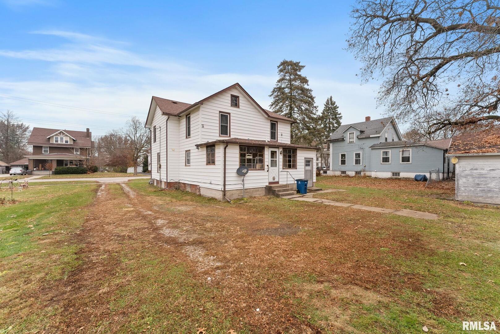 315 West Locust Street Cambridge, IL 61238 - Photo 18 of 27 a view of a house with a yard