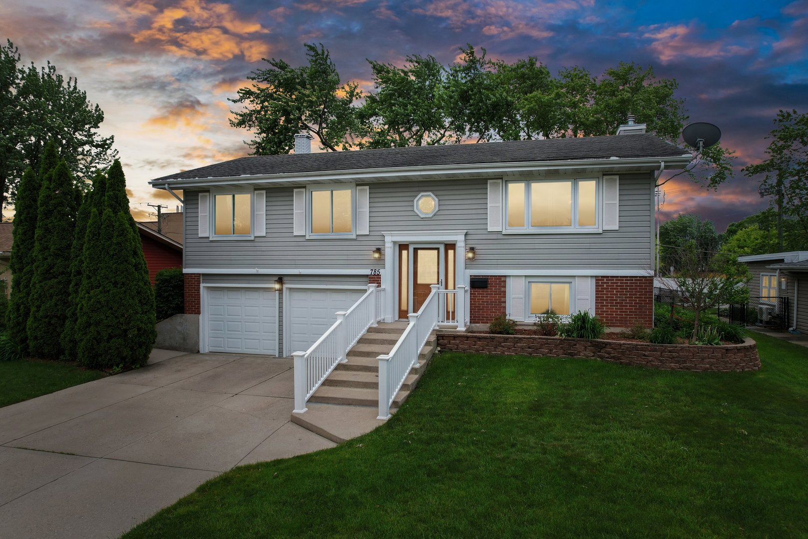 a front view of a house with a yard