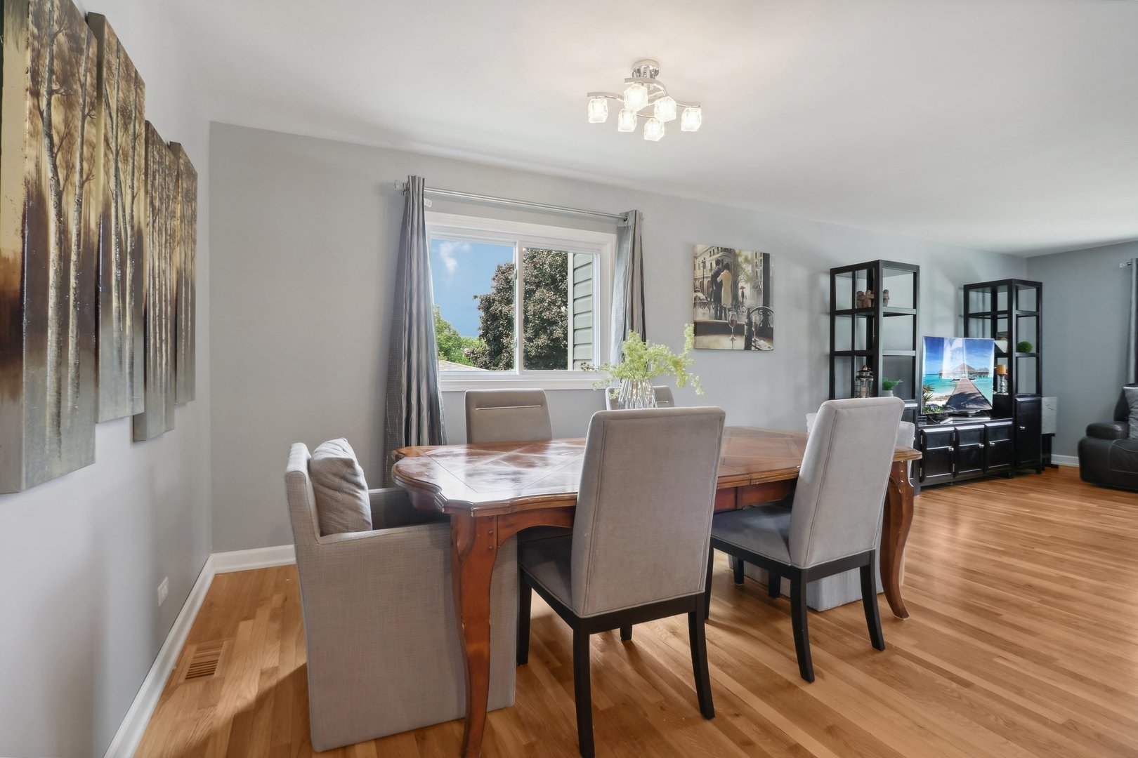 785 Cambridge Lane Hoffman Estates, IL 60169 - Photo 13 of 48 a view of a dining room with furniture window and wooden floor