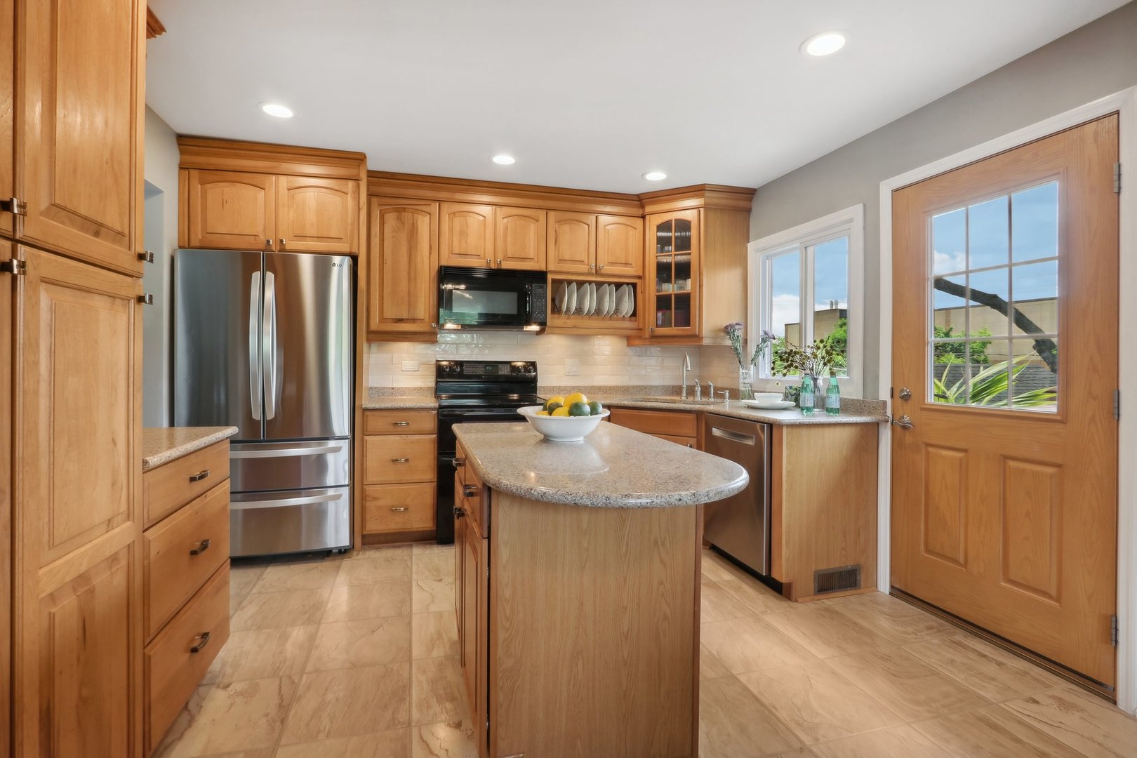 785 Cambridge Lane Hoffman Estates, IL 60169 - Photo 15 of 48 a kitchen with stainless steel appliances granite countertop a refrigerator and a sink
