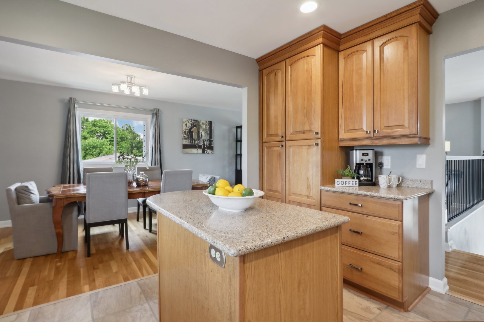 785 Cambridge Lane Hoffman Estates, IL 60169 - Photo 17 of 48 a kitchen with a stove a refrigerator and a dining table