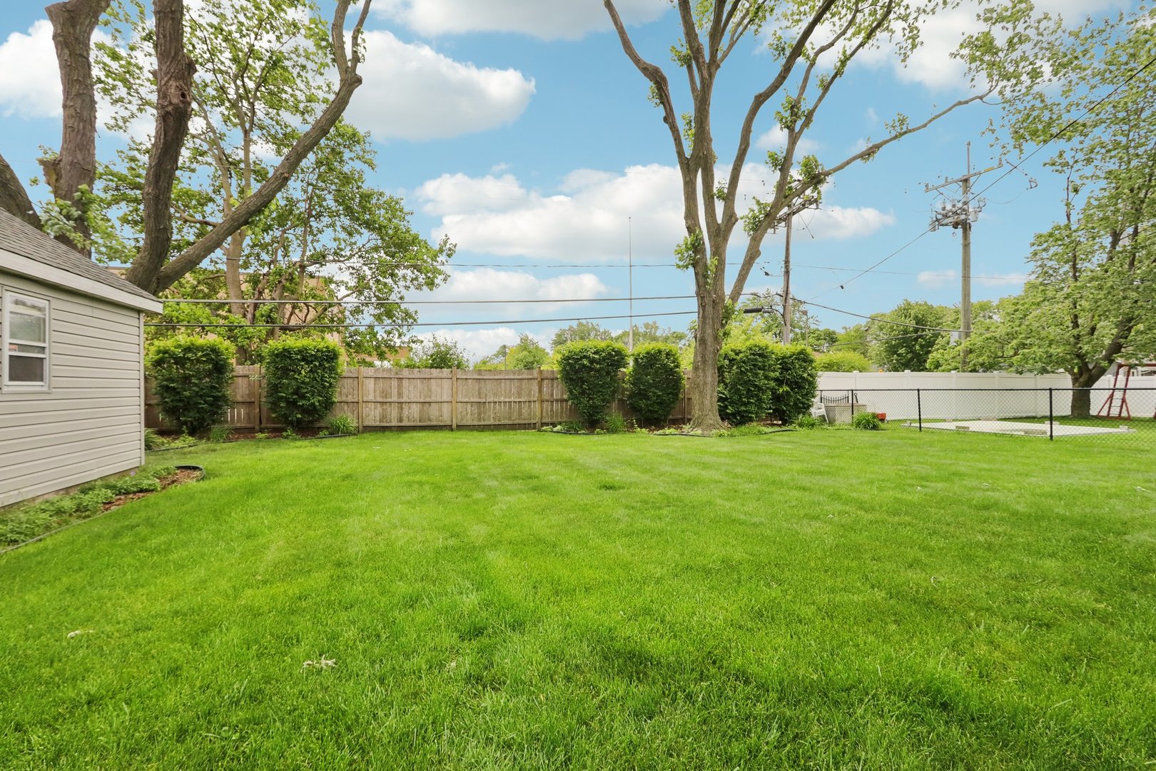 785 Cambridge Lane Hoffman Estates, IL 60169 - Photo 36 of 48 a view of yard with grass and trees