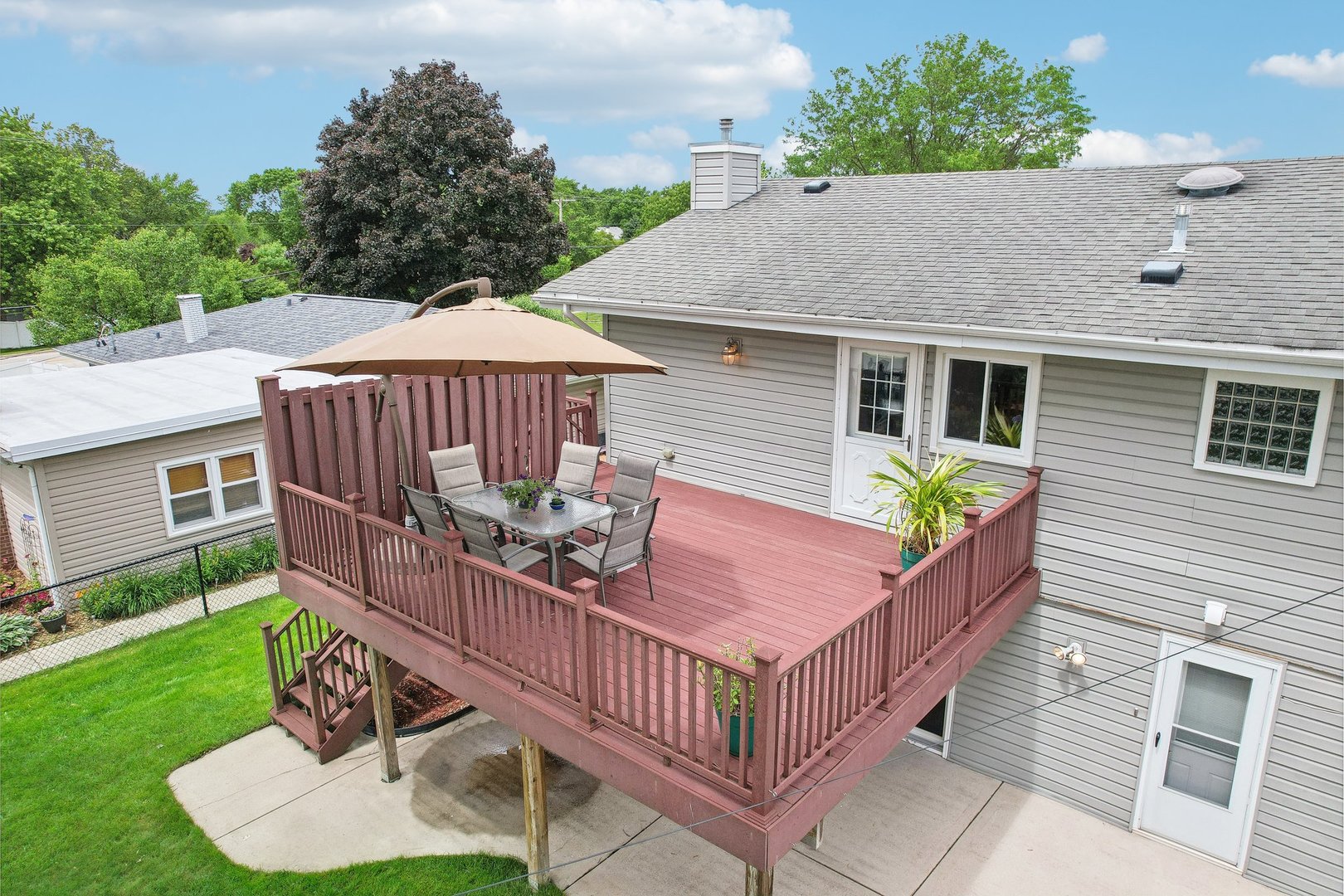 785 Cambridge Lane Hoffman Estates, IL 60169 - Photo 43 of 48 a view of a house with wooden deck and furniture