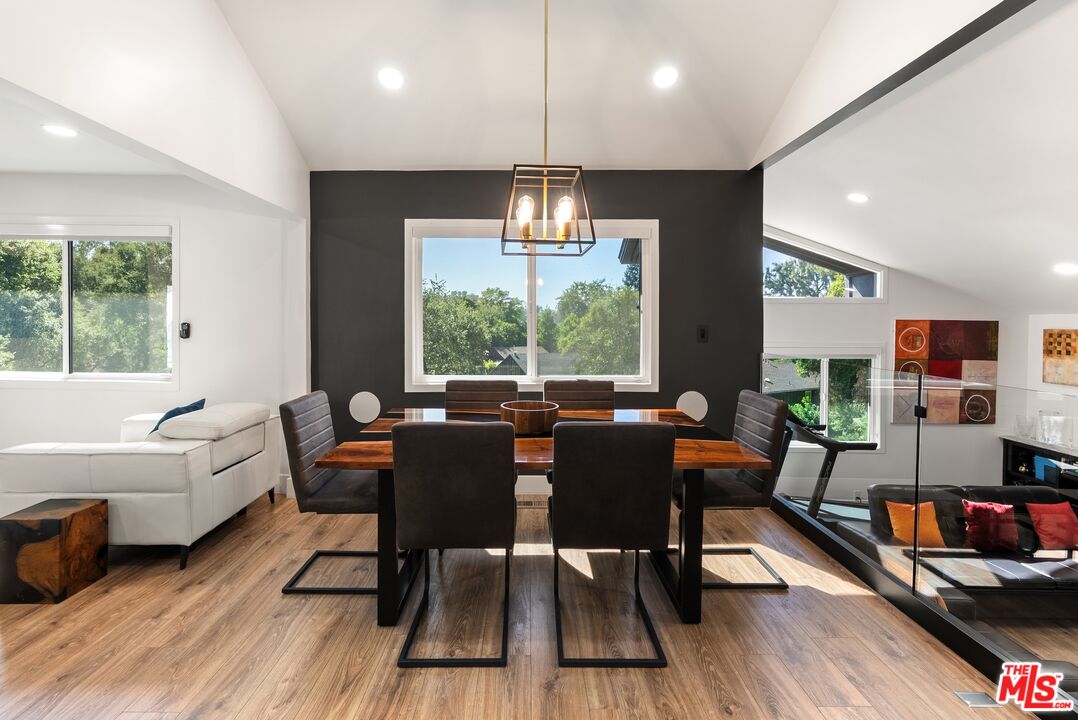 4118 Oak Hollow Road Calabasas, CA 91302 - Photo 13 of 55 a view of a dining room with furniture window and outside view