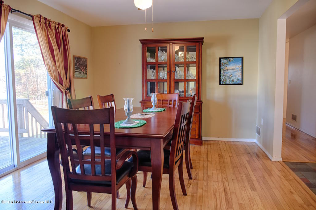 76 East Fish Road Jackson, NJ 08527 - Photo 11 of 38 Dining Room with sliders to deck