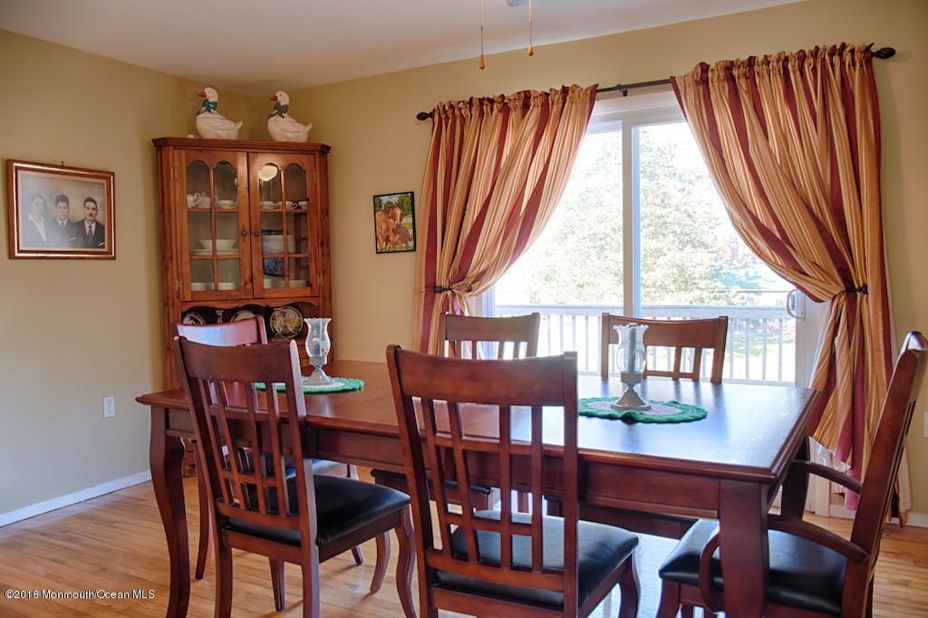 76 East Fish Road Jackson, NJ 08527 - Photo 12 of 38 Dining Room with sliders to deck