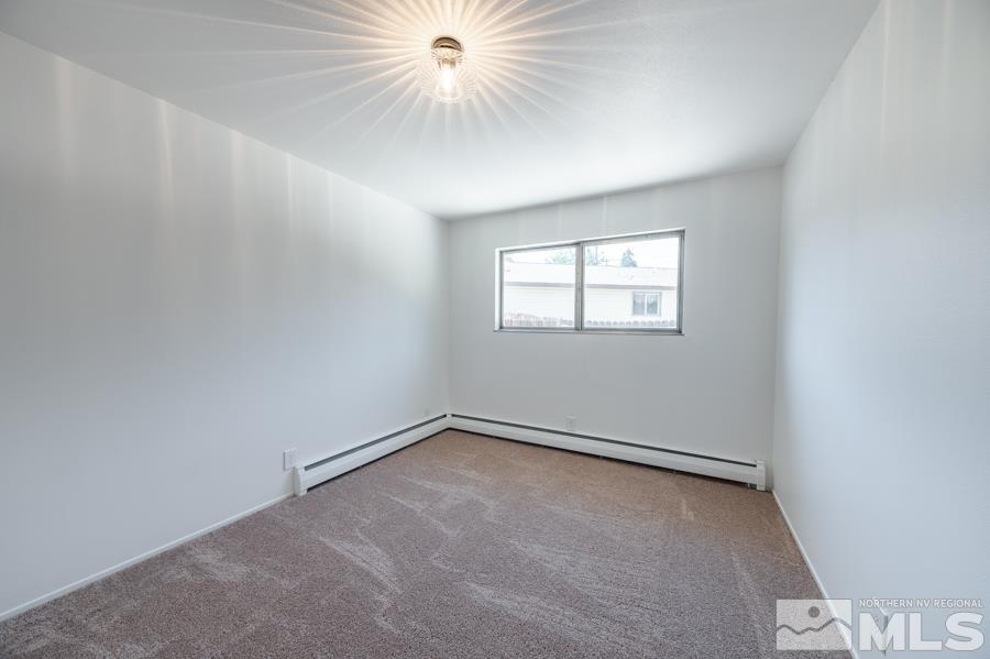 1325 Kings Court Reno, NV 89503 - Photo 11 of 14 an empty room with windows and fan