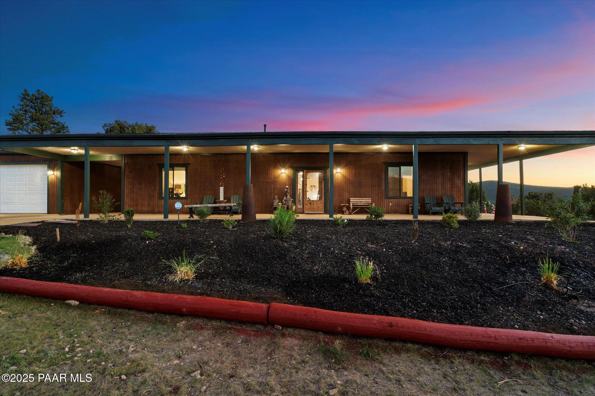 33425 Cowboy Clint Road Seligman, AZ 86337 - Photo 12 of 79 a front view of a house with a yard