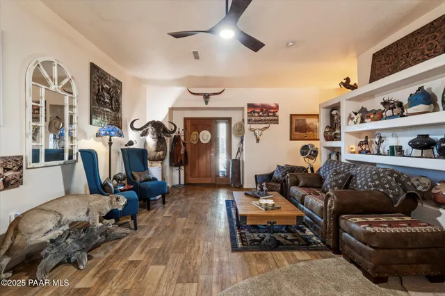 a bedroom with a bed couch and window