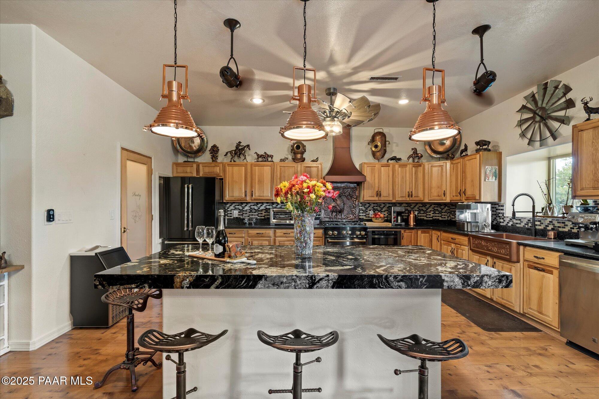 33425 Cowboy Clint Road Seligman, AZ 86337 - Photo 25 of 79 Large marble island and copper lights