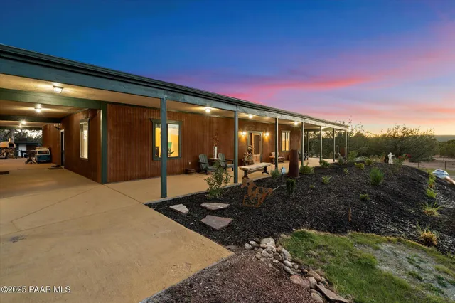 a living room with lots of furniture and a flat screen tv
