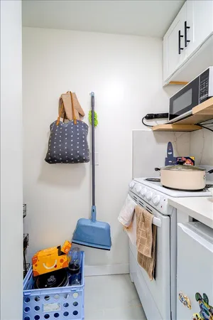 a kitchen with stainless steel appliances granite countertop a sink and a stove