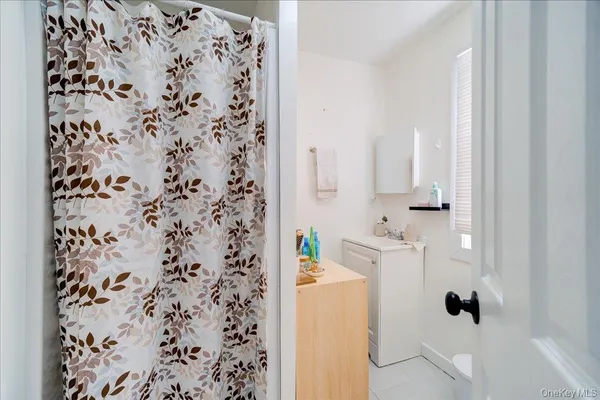 a bathroom with a shower curtain