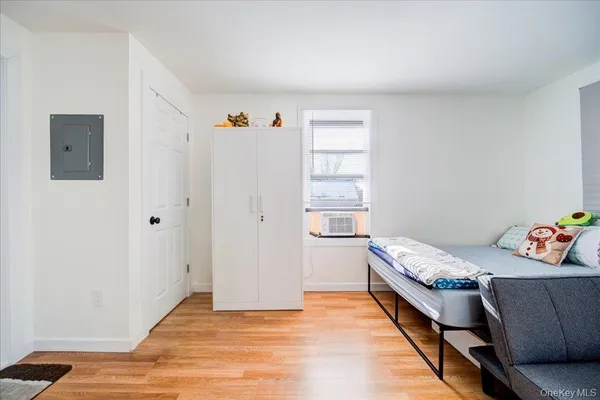 a room with a bed and a window