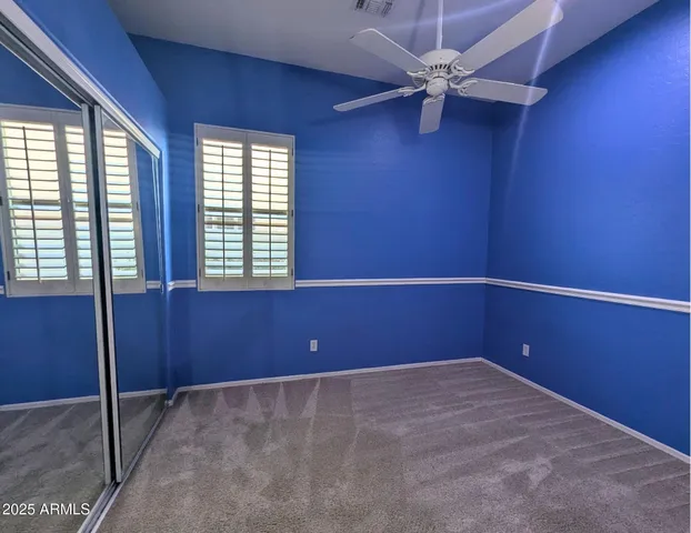 a bathroom with a double vanity sink toilet mirror and shower