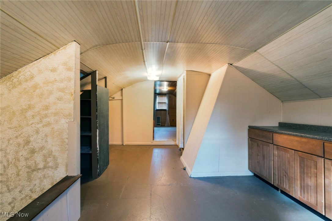 6050 Shaffer Road Northwest Warren, OH 44481 - Photo 22 of 39 Bonus room with vaulted ceiling, finished concrete flooring, and wood ceiling