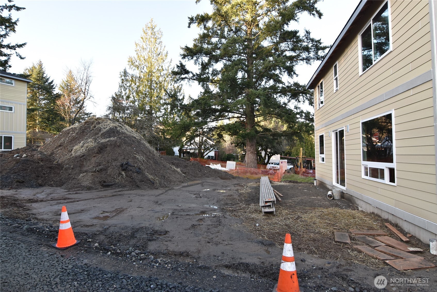 1323 Roland Street Bellingham, WA 98229 - Photo 4 of 8 a man is sitting on a bench in a backyard