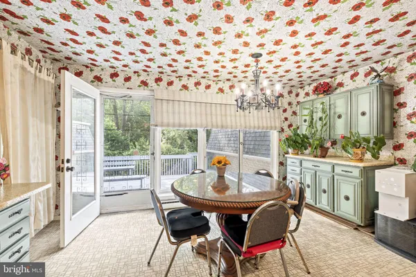 a view of a dining room with furniture window and outside view