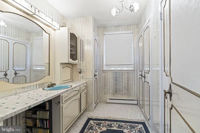 a spacious bathroom with a granite countertop sink mirror and double
