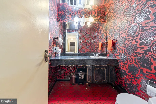 a spacious bathroom with a double vanity sink and a mirror