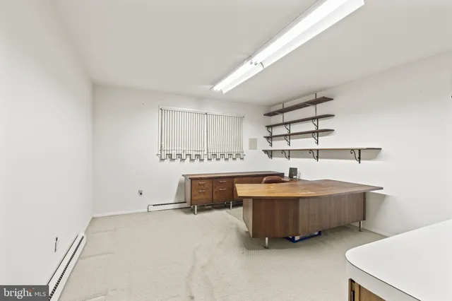 a view of a patio with table and chairs