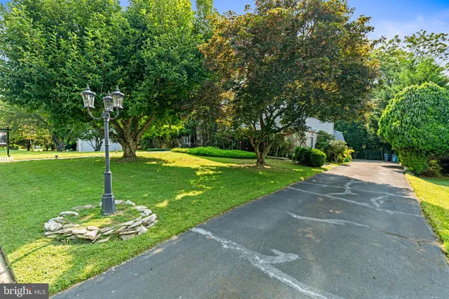 an aerial view of a house with yard and outdoor seating