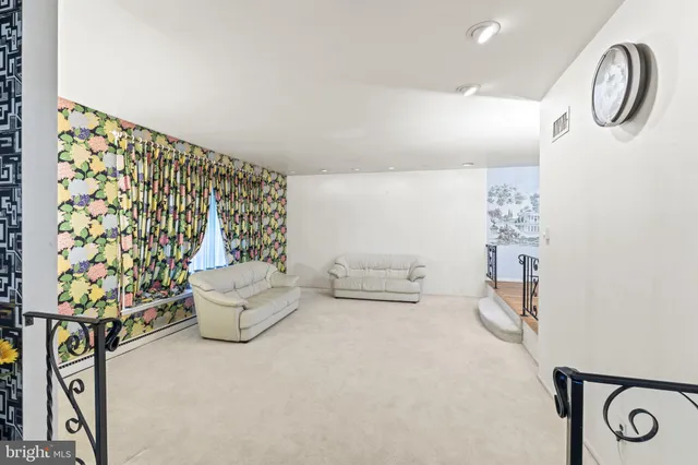 a bathroom with a toilet and a shower curtain