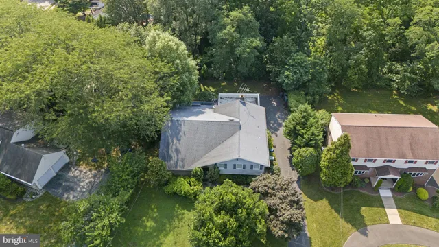 an aerial view of a house with a yard and a garden