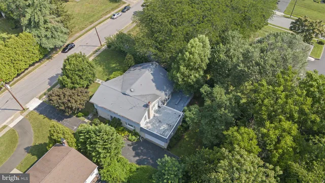 an aerial view of a house with yard swimming pool and outdoor seating