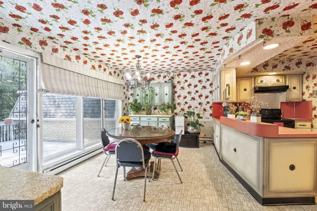 a dining room with furniture and a window