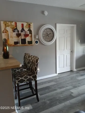 a view of a livingroom with furniture and wooden floor