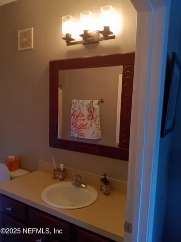 a bathroom with a toilet and a shower curtain