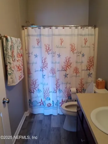 a bedroom with bed and a lamp