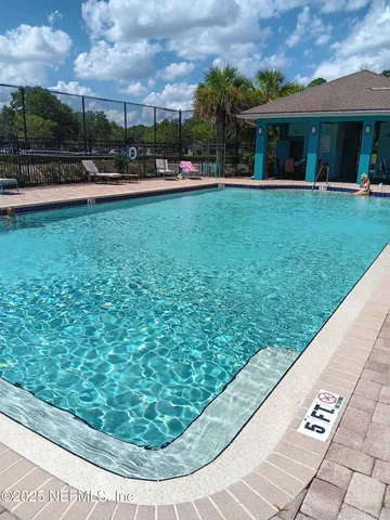 a white toilet sitting next to a shower