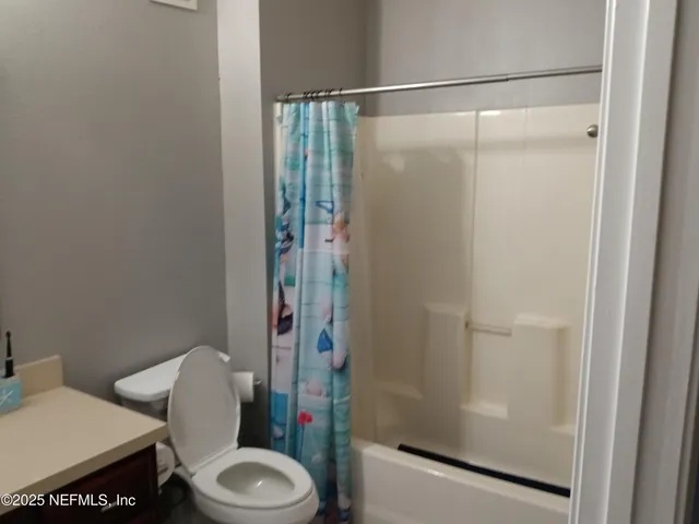 a view of a balcony and yard