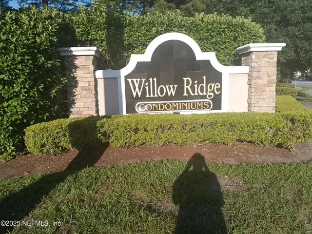 a view of a hardwood & utility room