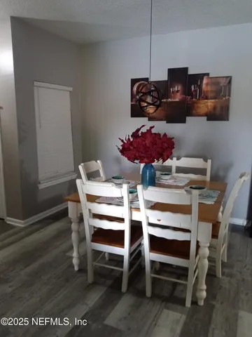 a view of a dining room with furniture