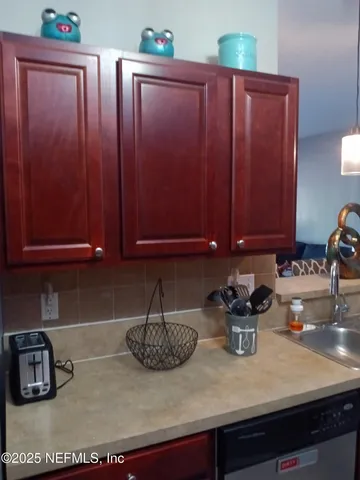 a kitchen with a sink and cabinets