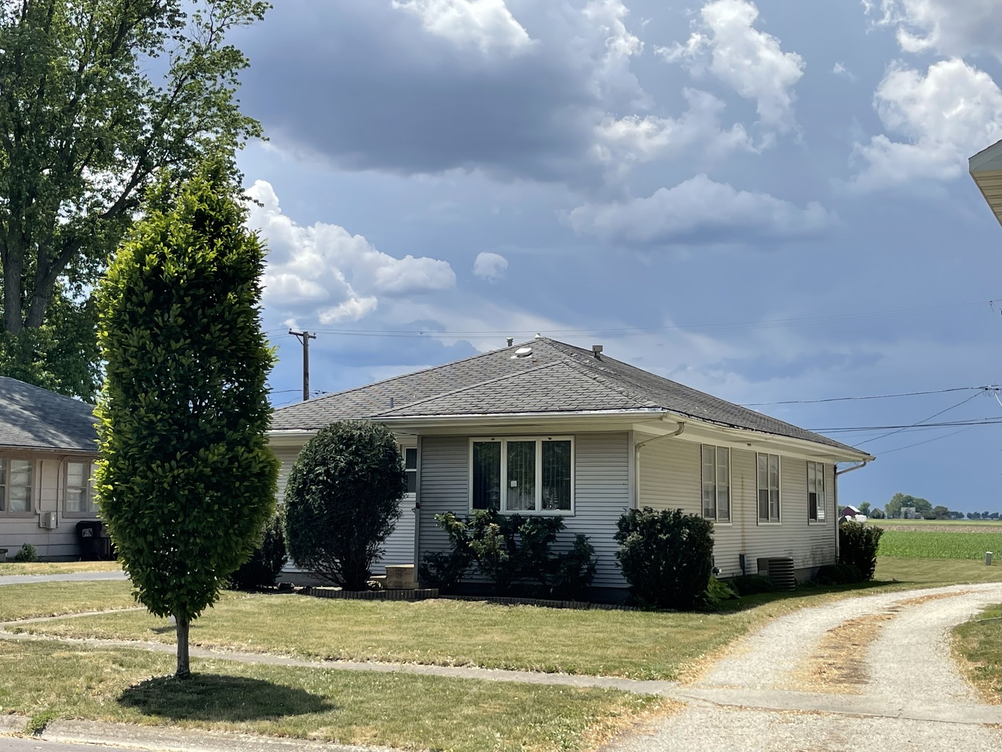 245 South Elm Street Herscher, IL 60941 - Photo 3 of 18 a front view of a house with a garden and trees