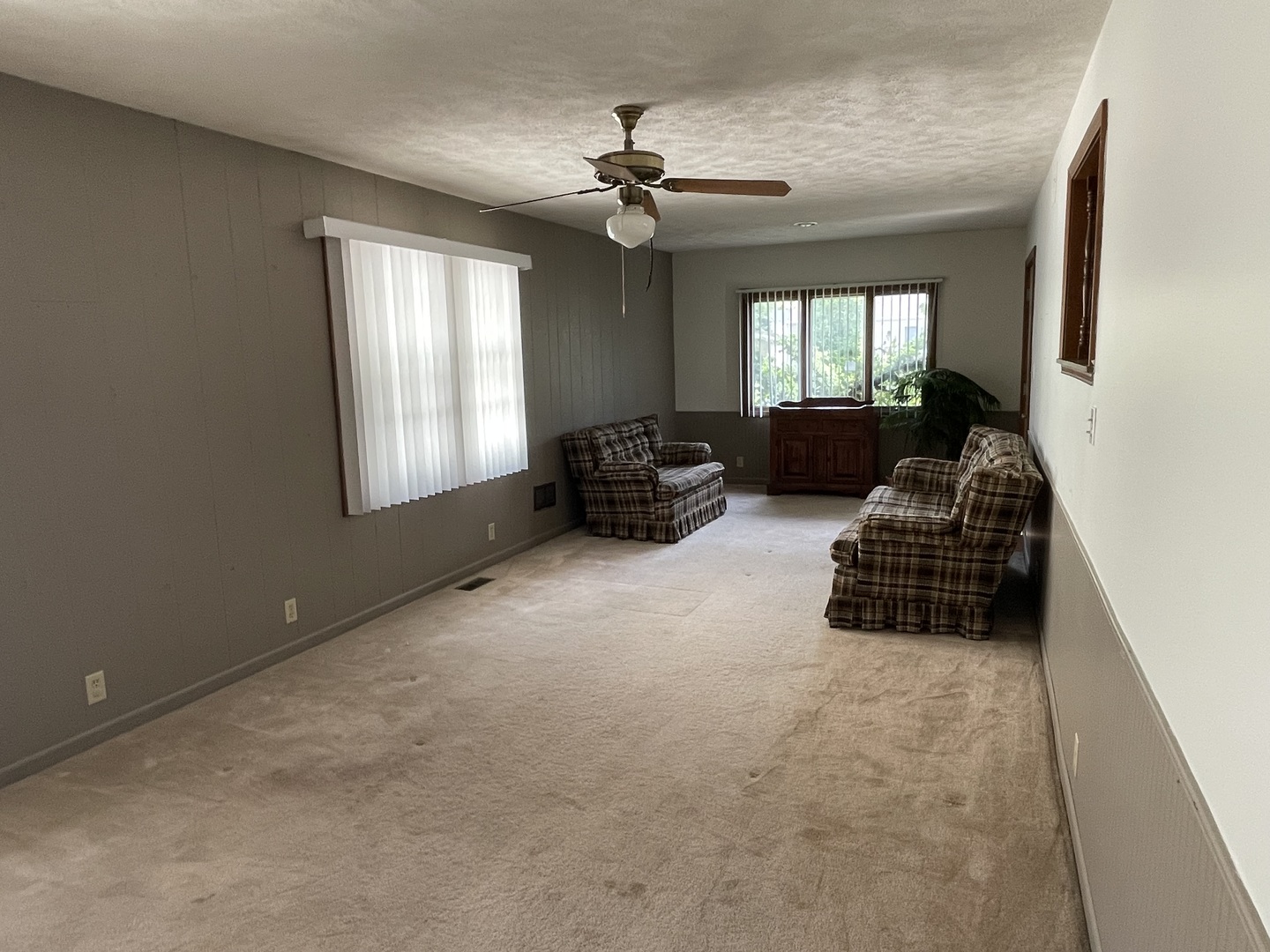 245 South Elm Street Herscher, IL 60941 - Photo 4 of 18 a living room with furniture ceiling fan and a window