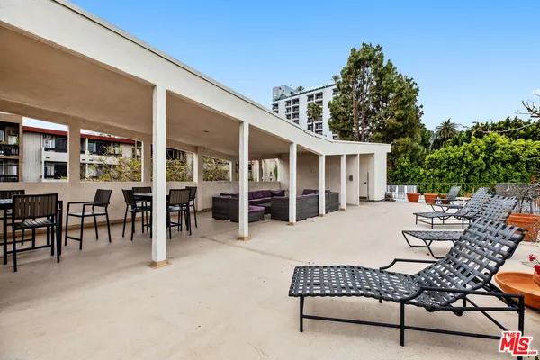 a outdoor space with a couch and chairs